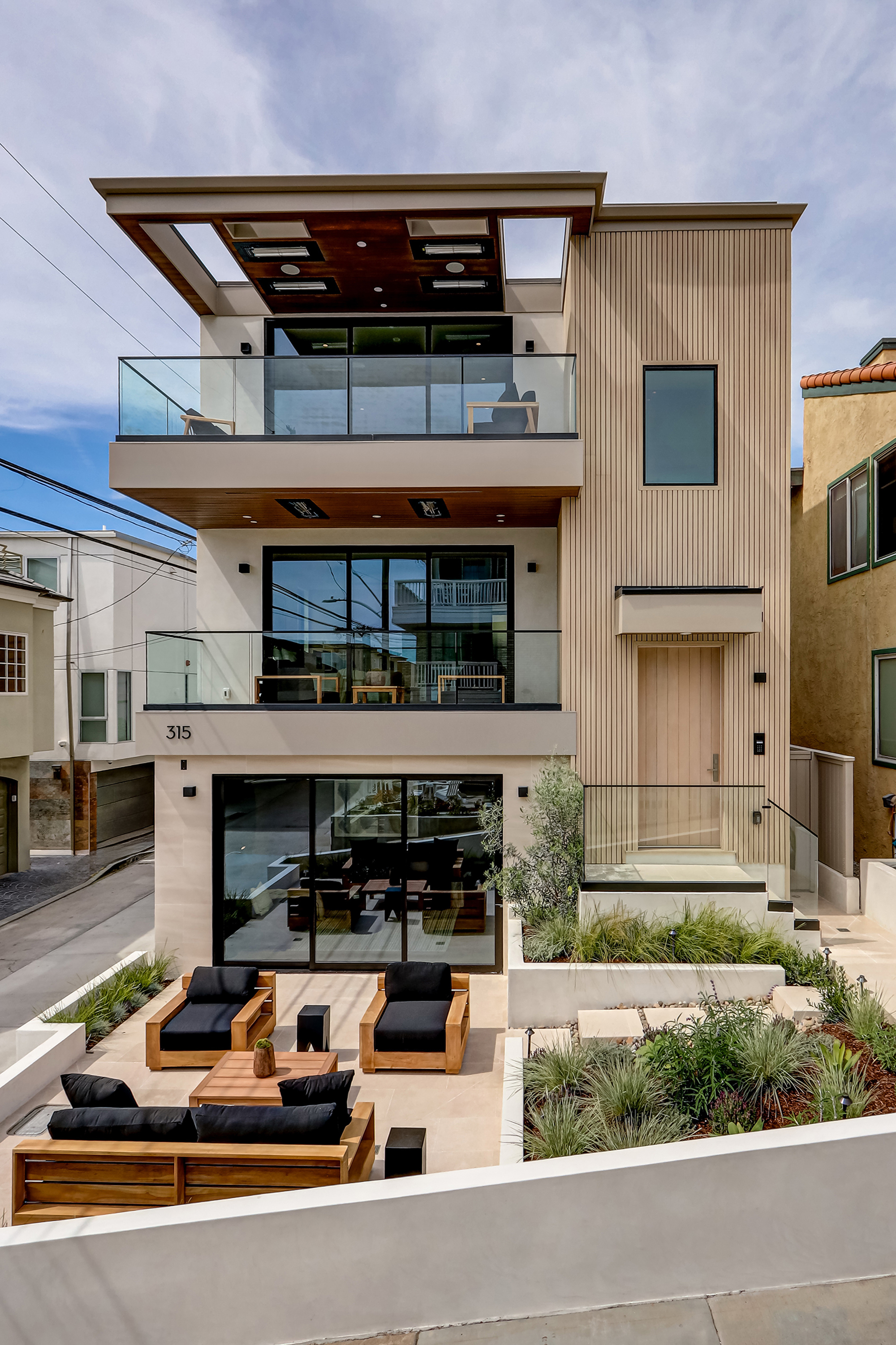 Day-time exterior with full architectural facade visible from the walk-street